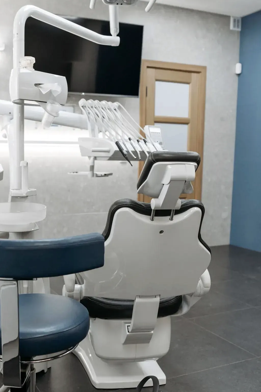 Bright dental treatment room with an empty chair