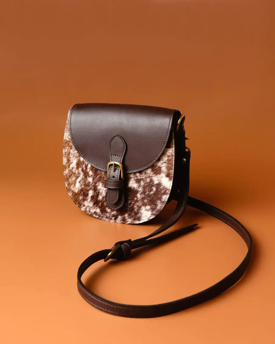 Brown leather sling bag with buckle