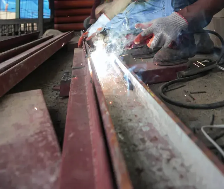 Worker welding a metal structure